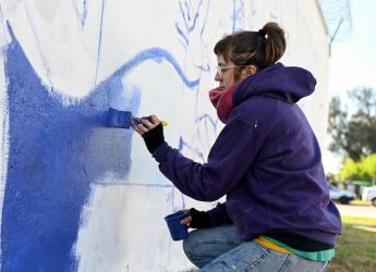 Pintada de mural por campaña «Informando a las mujeres, transformando vidas»